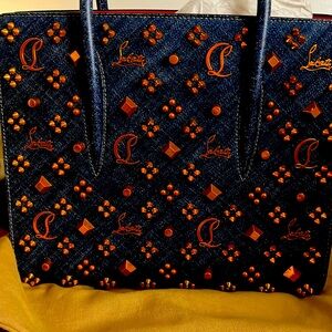 Louboutin Paloma Bag in Miss denim with gold accents.